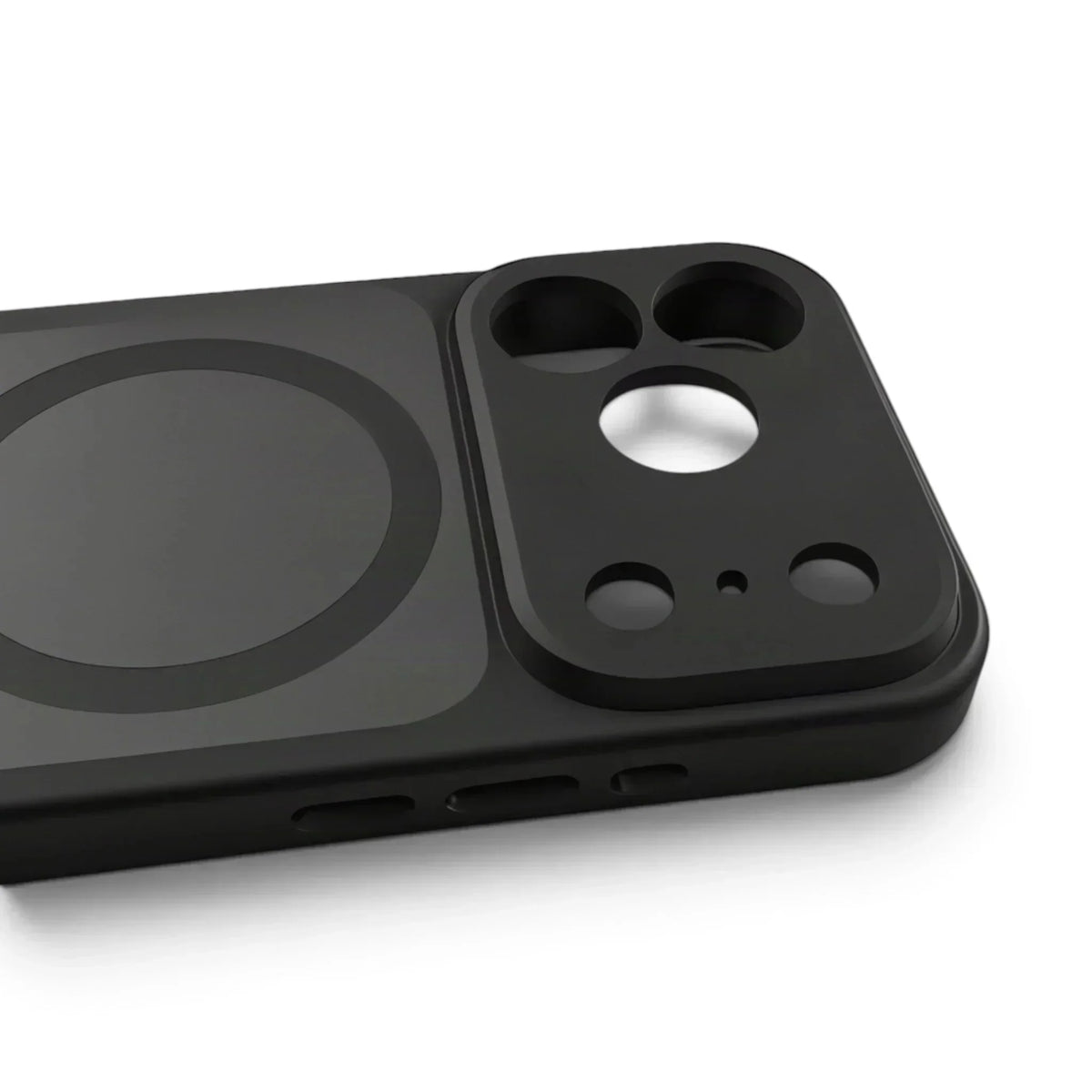 Close-up of a matte black MagSafe iPhone case showing the camera cutout and magnetic ring.